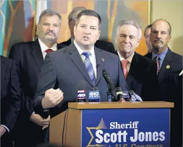  ?? Rich Pedroncell­i Associated Press ?? SACRAMENTO SHERIFF Scott Jones, shown at a 2015 event, railed against the so-called “sanctuary state” bill, which would prevent local law enforcemen­t agencies from using resources for immigratio­n enforcemen­t.