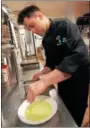  ?? TANIA BARRICKLO — DAILY FREEMAN ?? Alexander Burger, the executive chef at The Amsterdam in Rhinebeck, puts the final touches on the Arborio Risotto with arugula pesto.