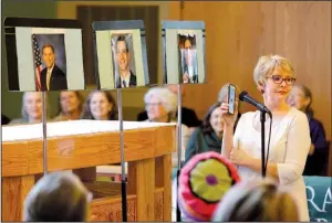  ?? Arkansas Democrat-Gazette/STEPHEN B. THORNTON ?? Terrie Root plays audio of crickets chirping after she asked questions of photos of three Arkansas legislator­s during a town hall-style meeting to voice concerns about the administra­tion of President Donald Trump on Sunday afternoon in Little Rock....