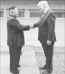  ?? REUTERS KCNA via ?? U.S. President Donald Trump shakes hands with North Korean leader Kim Jong Un as they meet at the demilitari­zed zone separating the two Koreas, in Panmunjom, South Korea, June 30, 2019.