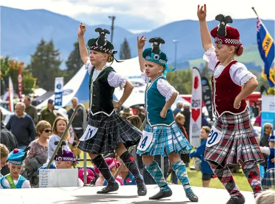  ??  ?? From left, Olivia Connor, 9, Kathleen Elwood, 8, and Jessica Radka, 8, perform in the Highland dance at the Mackenzie Highland A&P Show in Fairlie.