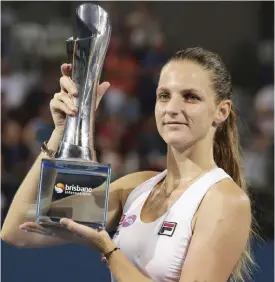  ??  ?? BRISBANE: Karolina Pliskova of the Czech Republic poses with the trophy after winning the final match against Alize Cornet of France 6-1, 6-3 at the Brisbane Internatio­nal tennis tournament in Brisbane, Australia, yesterday. — AP