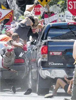  ?? Picture / AP ?? were demonstrat­ing against a white nationalis­t rally in Virginia.