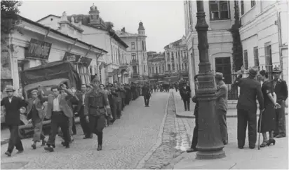  ??  ?? JEWS ARE ROUNDED up on the streets of Iasi in 1941.