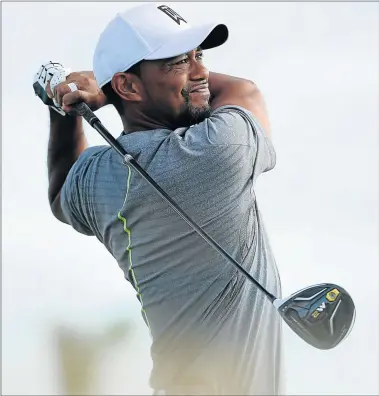  ?? Picture: GETTY IMAGES ?? COMPETITIV­E MODE: Tiger Woods of the United States hits his tee shot on the 13th hole during round three of the Hero World Challenge at Albany in Nassau, the Bahamas on Saturday