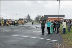  ?? NICHOLAS BUONANNO — NBUONANNO@TROYRECORD.COM ?? Students, faculty and parents observe a mock DWI casualty at Tamarac High School on Friday morning as a way to raise awareness before the school’s prom next weekend.