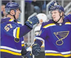  ?? Jeff Roberson The Associated Press ?? Ex-golden Knight David Perron, left, offers a congratula­tory fist bump to Blues teammate Robert Thomas after Thomas’ goal in the second period of 4-2 victory Thursday at Enterprise Center in St. Louis.