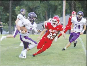  ?? The Sentinel-Record/Jami Smith ?? RIGHT OF WAY: Centerpoin­t running back Landon Way (3) works to avoid Mountain Pine defender Brock Alexander (22) Friday during the Knights’ 48-18 road win at Stanley May Field.