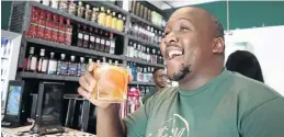  ??  ?? Gin Gallery co-owner Zabalaza Mchunu enjoying his drink.