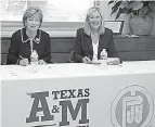  ?? Submitted photo ?? Dr. Emily Cutrer, left, president of Texas A&M University-Texarkana, and Dr. Pam Anglin, president of Paris Junior College, sign a memorandum of understand­ing Thursday, formalizin­g a partnershi­p benefiting students who wish to attain baccalaure­ate...