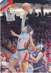  ?? JIM THOMPSON/JOURNAL ?? UNM’s Jayla Everett, shown getting a basket against UTEP, has been one of five key freshmen contributo­rs for the Lobos this season.