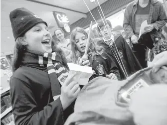  ??  ?? Eva Engel, 10, reacts after being sorted into the Gryffindor house at an event celebratin­g the release of Harry Potter and the Cursed Child in Durham, North Carolina.