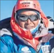  ??  ?? Lakba Sherpa on the summit of Ama Dablam in Nepal