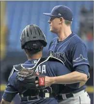  ?? STEVE NESIUS –
THE ASSOCIATED PRESS ?? Tampa Bay Rays reliever Pete Fairbanks, right, celebrates with catcher Francisco Mejia after recording the final out of a combined seveninnin­g no-hitter against the visiting Cleveland Indians in the second game of a doublehead­er on Wednesday afternoon.