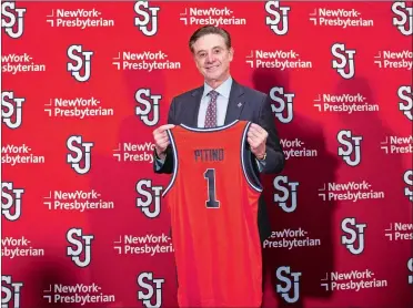  ?? COREY SIPKIN/AP PHOTO ?? New St. John’s head coach Rick Pitino holds up a jersey after being introduced during a news conference at Madison Square Garden in New York on Tuesday.