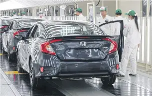  ?? PATTANAPON­G HIRUNARD ?? The Honda Civic sedan is assembled at the second plant in Prachin Buri. All Honda cars are made for domestic sale and export.