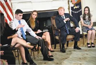  ?? Andrew Harrer / Bloomberg ?? President Trump hosts a listening session on gun violence at White House last month. High school students, teachers and parents shared their views following the Florida school shooting.