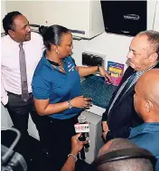  ??  ?? Members of the government of Dominica, the media, and other guests are taken through the Sagicor mobile medical unit following its handover to the Government of Dominica last month.