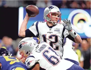  ??  ?? Patriots quarterbac­k Tom Brady passes against the Rams during Super Bowl LIII on Sunday in Atlanta.