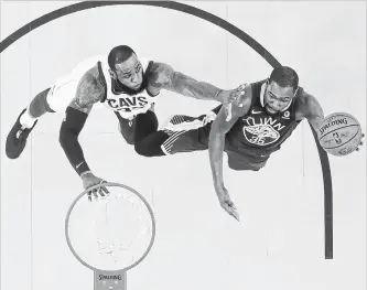  ?? EZRA SHAW GETTY IMAGES ?? LeBron James of the Cleveland Cavaliers, left, tries to block friend and opponent Kevin Durant of Golden State in Game 2 of the NBA finals at Oracle Arena on Sunday. Game 3 is Wednesday in Cleveland.