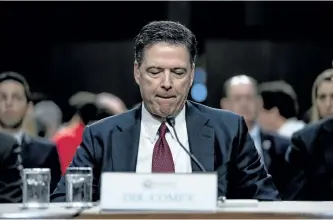  ?? ANDREW HARNIK/THE ASSOCIATED PRESS ?? Former FBI director James Comey pauses during his testimony during a Senate intelligen­ce committee hearing on Capitol Hill in Washington on Thursday.