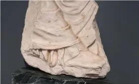  ?? Photograph: AP ?? The fragment, part of a draped figure from the east side of the Parthenon frieze.