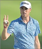  ?? DAVID DERMER — ASSOCIATED PRESS ?? Justin Thomas waves after putting on the 18th hole, ending a day in which he had six birdies and took a three-shot lead.