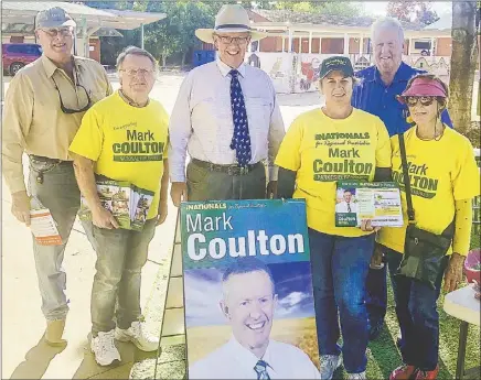  ??  ?? Mark Coulton was returned as Member for Parkes, maintainin­g once of the strongest margins in Australia. He’s pictured with supporters in Dubbo on Saturday after voting in Moree earlier in the day. PHOTO: SUPPLIED