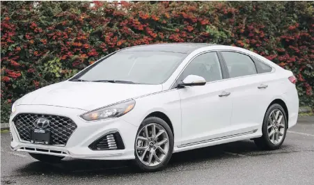  ??  ?? The 2018 Sonata looks more aggressive than last year’s model, with a larger, gaping grille.