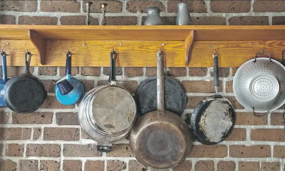  ??  ?? Assess how the things you use most in your kitchen are stored. Are they accessible? You can group like items, such as saucepans and cookware, to make their storage practical and attractive.