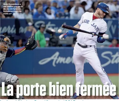  ?? PHOTO AFP ?? Josh Donaldson a été atteint par un tir de Jacob Faria en troisième manche.