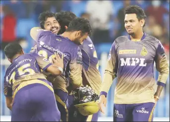  ?? ?? Teammates, including West Indian Sunil Narine (right) mob Rahul Tripathi after he hit the winning runs to put Kolkata Knight Riders in the final of the Indian Premier League. (IPLT20 photo)