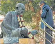  ?? PTI ?? CJI Dhananjaya Y Chandrachu­d pays tribute to Mahatma Gandhi in New Delhi on Wednesday.