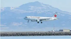  ??  ?? CLOSE CALL: An Air Canada plane prepares to land at San Francisco Internatio­nal Airport.