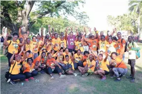  ??  ?? Dr Chris Tufton minister of health, sharing a moment with the Rainforest Seafoods Team at Everyone’s A Winner/Running Events 5K/10K Run/Walk held last month.