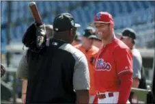  ?? LYNNE SLADKY - AP ?? Philadelph­ia Phillies manager Gabe Kapler, right, talks with a member of the Baltimore Orioles coaching staff before Saturday’s spring training game in Clearwater, Fla.