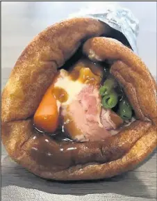  ??  ?? Cob Full, which is part of the Eat Lean store in the Market Place in Hinckley is selling a giant Yorkshire pudding wrap