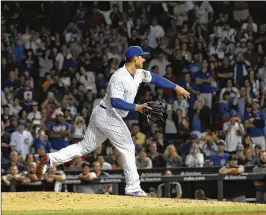  ?? DAVID BANKS/GETTY IMAGES ?? Cubs first baseman Anthony Rizzo was called upon to pitch in the ninth inning of a game against the Diamondbac­ks, who led 7-1 at the time. He threw two pitches, recorded an out and escaped with a 0.00 ERA.