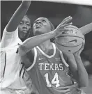  ?? JOHN RAOUX/AP ?? Texas forward Amina Muhammad shoots against Central Florida forward Achol Akot on Saturday.