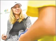  ?? Peter Hvizdak / Hearst Connecticu­t Media ?? WTA tennis player Simona Halep, the No. 1 ranked player in the world, signs autographs Monday at the Connecticu­t Open at the Connecticu­t Tennis Center in New Haven.