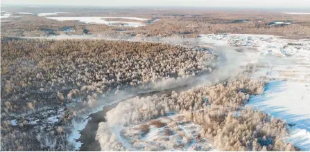  ?? Xinhua-Yonhap ?? An aerial drone photo taken on Feb. 2 shows the rime scenery along the Kurbin River near Pingtai Village in northeast China’s Heilongjia­ng province. Personal transactio­ns of rural land are strictly forbidden under the rules of property ownership. Changing the rules on land in the countrysid­e carries particular appeal at this moment due to several urgent economic issues, in particular, an urban-rural divide which has blunted plans for revitaliza­tion.