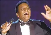  ?? CHARLIE NEIBERGALL AP FILE ?? Charley Pride performs during his induction into the Country Music Hall of Fame in 2000.