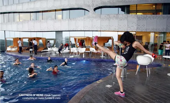  ??  ?? LIGHTNESS OF BEING Vijaya Tupurani
conducting an Aqua Zumba ® class