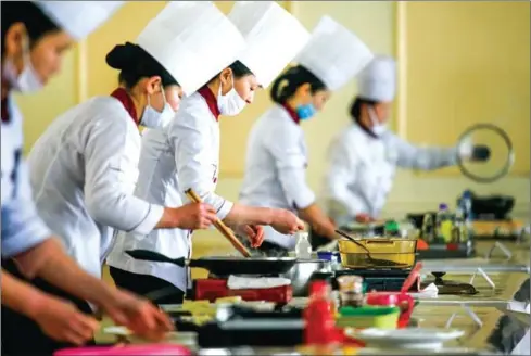  ?? ED JONES/AFP ?? Chefs prepare food during North Korea’s national cooking competitio­n in Pyongyang on Wednesday.