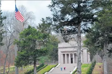  ?? CHRISTOPHE­R SULLIVAN/AP PHOTOS ?? Visitors mount the stairs of the Memorial Building at the Abraham Lincoln Birthplace National Historical Park.