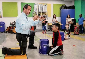  ?? ?? Perea teaches a fourth-grade class during the first week of school. “He kind of lives in the ‘have fun’ world,” says former Principal Joseph Cerna.