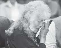  ?? Ed Kaiser/postmedia News ?? Residentia­l school survivor Flora Northwest wipes tears at the Truth and Reconcilia­tion Regional Hearing in Hobbema on Wednesday.