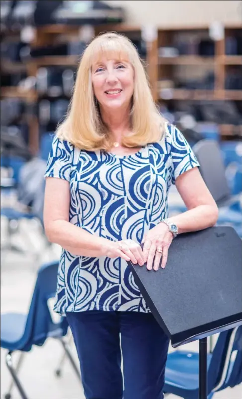  ?? WILLIAM HARVEY/RIVER VALLEY & OZARK EDITION ?? Greenbrier Middle School band director Judy Harkrider stands in the junior high band room. She will retire this year after 38 years as a band director, including 30 in Greenbrier. A drop-in retirement reception for Harkrider is scheduled for 2-4 p.m....