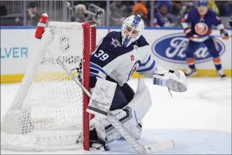  ?? FRANK FRANKLIN II — THE ASSOCIATED PRESS ?? Winnipeg Jets goaltender Laurent Brossoit (39) protects the net during the second period of an NHL hockey game against the New York Islanders, Saturday, March 23, 2024, in Elmont, N.Y.