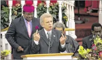  ?? ALLEN
EYESTONE / THE
PALM BEACH POST ?? Palm Beach Gardens City Council Member Joe Russo speaks Monday night to the rally at Hilltop Missionary Baptist Church. Behind him is Riviera Beach Mayor Thomas Masters.